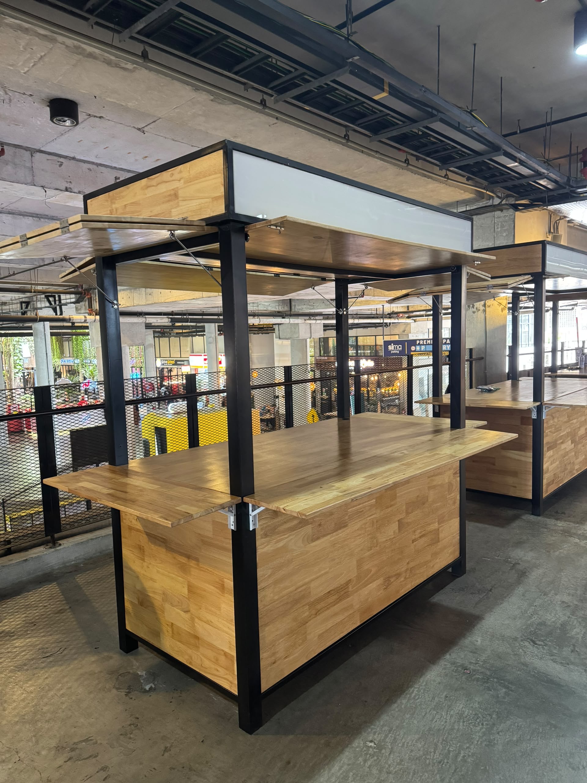Custom rubberwood fingerjoint kiosk at Tamarind Square